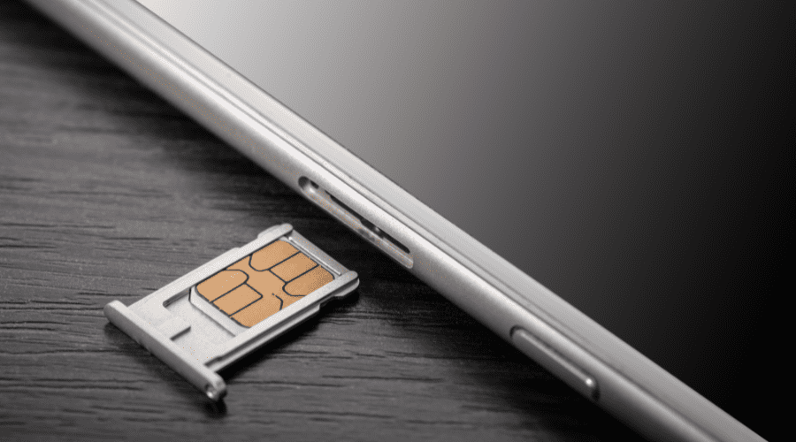sim card being inserted into a smart phone
